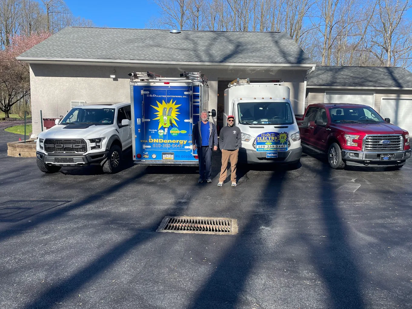 D & D Electric team with service trucks